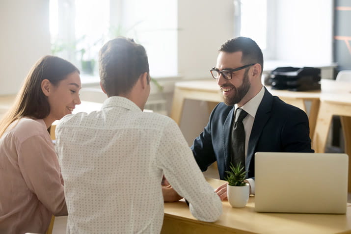 couple-with-solicitor-looking-at-legal-documents